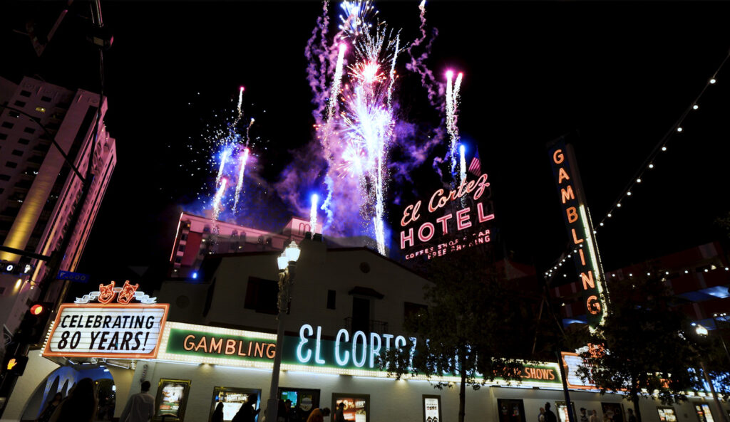 Fireworks light up the night sky above the El Cortez Hotel, where neon signs and a marquee celebrate 80 years of rich history.